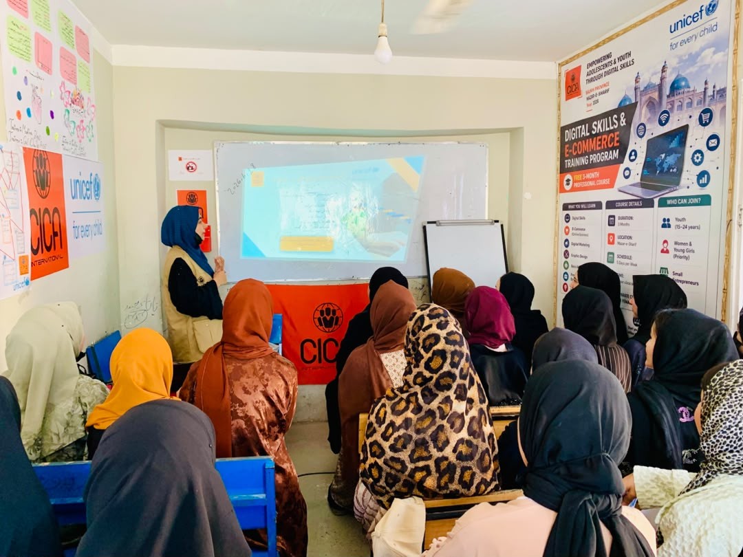 Trainer leading a classroom session for women