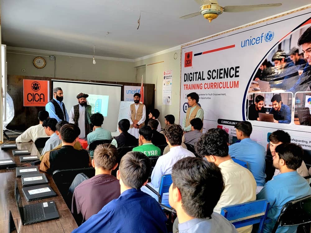 Participants and facilitators in a digital-skills classroom