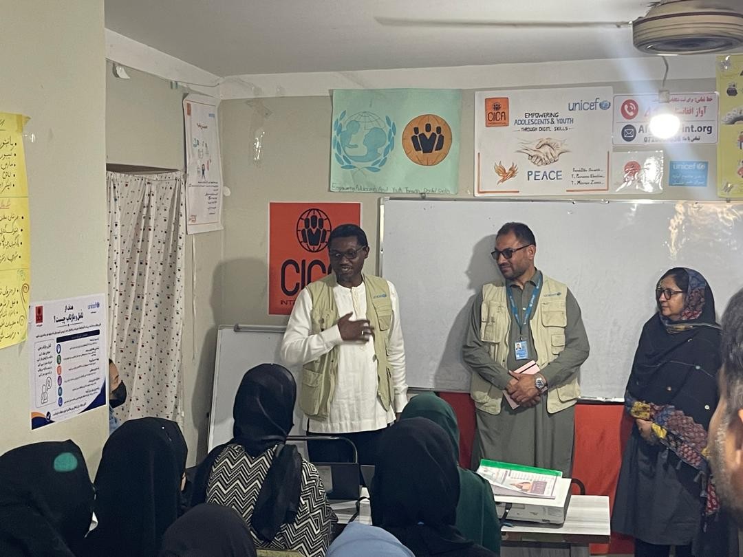 Visitors speaking with participants at the training centre